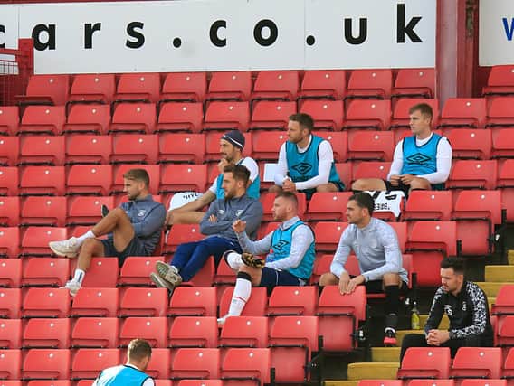 Luton's substitutes watch on at Barnsley earlier in the season