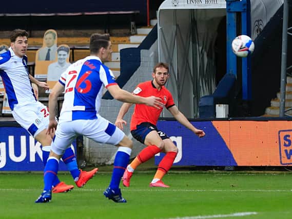 Rhys Norrington-Davies sends over a cross against Blackburn on Saturday