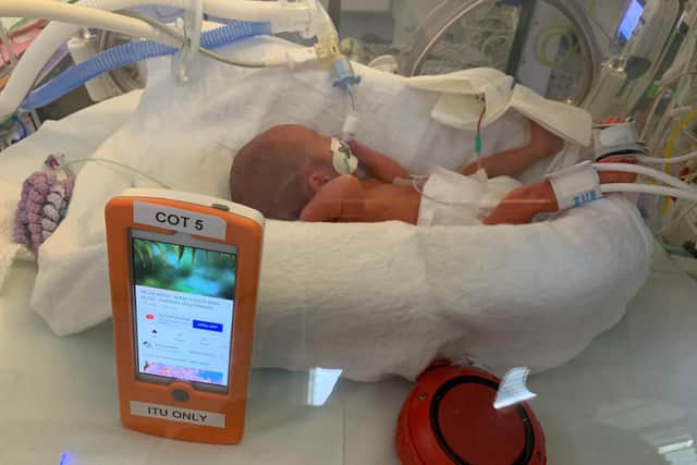 One week old Mally, born at 26 weeks, in the NICU at Luton and Dunstable University Hospital, listening to specially composed music via a Bluetooth speaker placed in his incubator