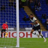 Jake Jervis celebrates scoring for the Hatters at Cardiff last season