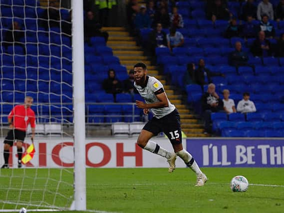 Jake Jervis celebrates scoring for the Hatters at Cardiff last season