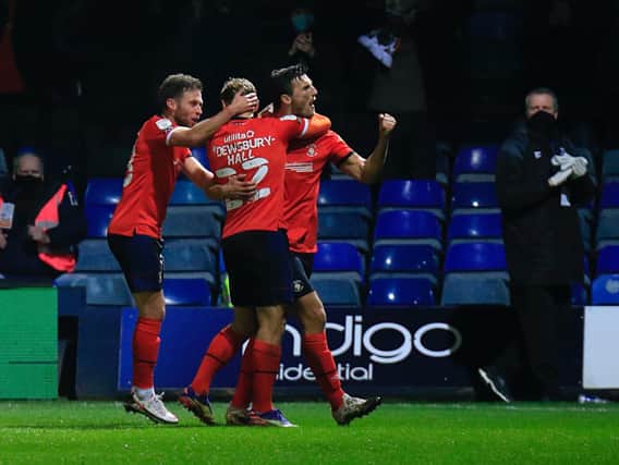 Matty Pearson celebrates his goal with midfielders Kiernan Dewsbury-Hall and Jordan Clark