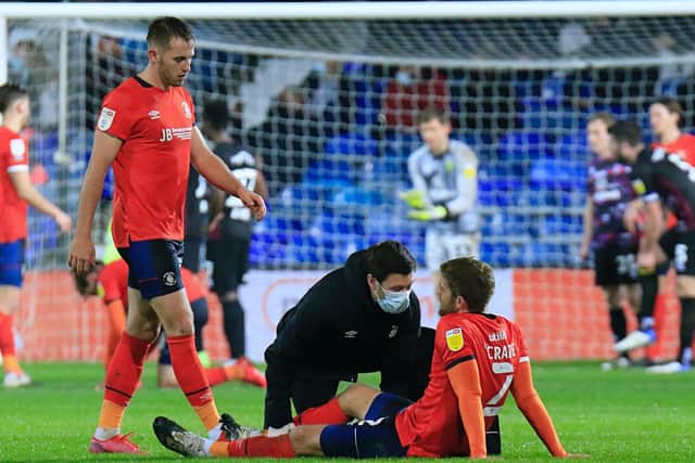 Martin Cranie receives treatment against Norwich on Wednesday night