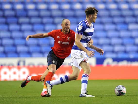Danny Hylton gets close to a Reading defender during the Carabao Cup tie back in September