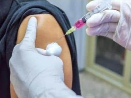 A vaccine being given