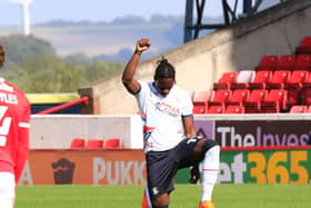 Pelly-Ruddock Mpanzu takes the knee against Barnsley earlier this season