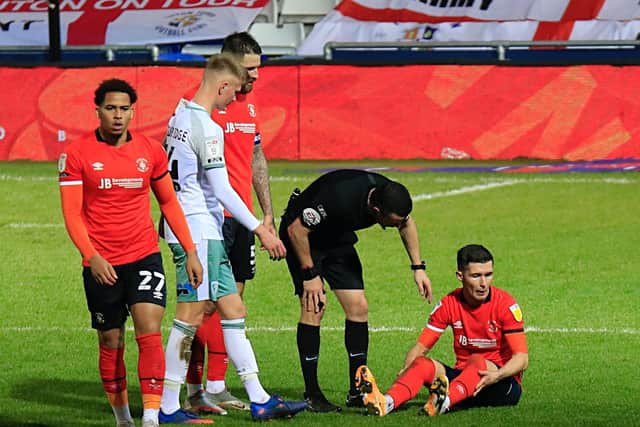 Dan Potts receives treatment during goalless draw against Bournemouth