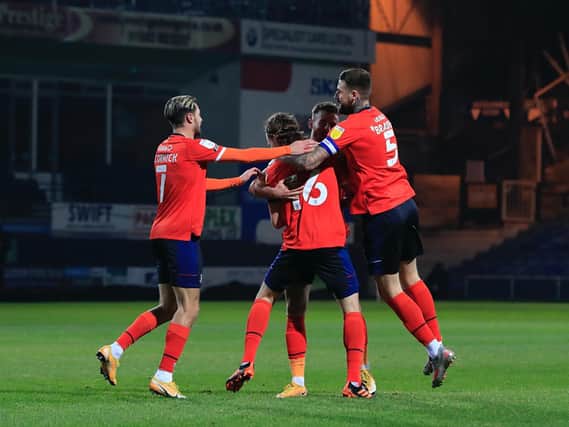 Glen Rea is mobbed after scoring a stunning volley against Bristol City this evening