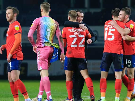 Nathan Jones gives midfielder Kiernan Dewsbury-Hall a hug after Tuesday night's 2-1 win over Bristol City