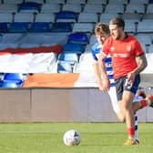Town midfielder George Moncur carries the ball forward against Reading