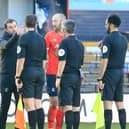 Hatters boss Nathan Jones speaks to the officials after Saturday's 1-0 win over Reading