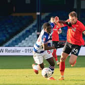 Town defender Rhys Norrington-Davies fights for possession in his last appearance against Reading on Saturday