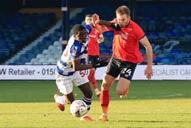 Town defender Rhys Norrington-Davies fights for possession in his last appearance against Reading on Saturday