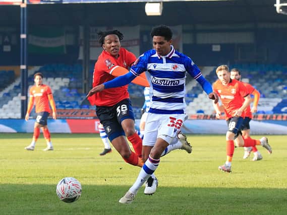 Town debutant Gabriel Osho tussles with former Reading team-mate Ethan Bristow on Saturday