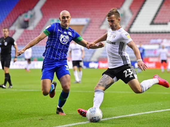 Kal Naismith makes a challenge for Wigan during their Championship campaign last season