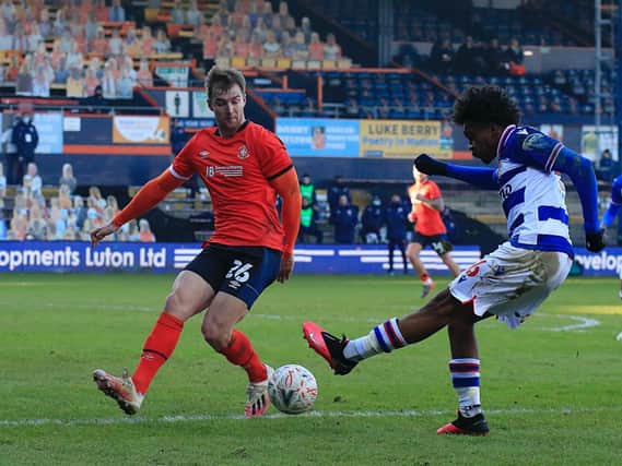 Town defender James Bree blocks a cross against Reading on Saturday