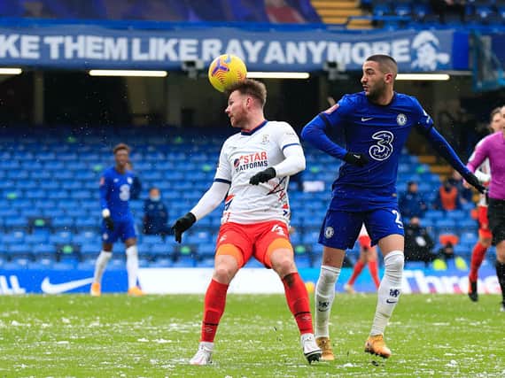 Ryan Tunnicliffe gets his head to the ball at Stamford Bridge this afternoon