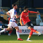 Luton defender Gabriel Osho moves the ball forward against Reading recently