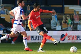 Luton defender Gabriel Osho moves the ball forward against Reading recently