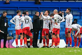 Nathan Jones addresses his Luton players during a break in play at Stamford Bridge