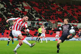 Luke Berry attempts to block a clearance during Luton's 3-0 defeat at Stoke last season