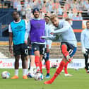 Andrew Shinnie warms up for the Hatters this season