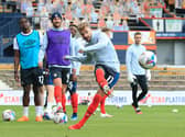 Andrew Shinnie warms up for the Hatters this season