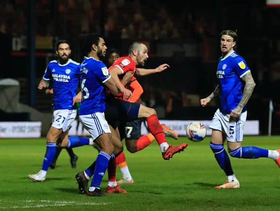 Danny Hylton is harried by the Cardiff defence on Tuesday night