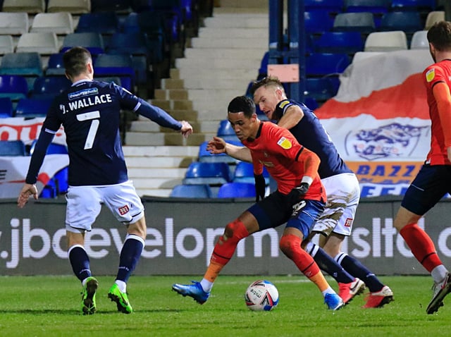 Tom Ince receives the ball under pressure against Millwall