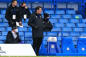Town assistant boss Mick Harford watches on from the sidelines
