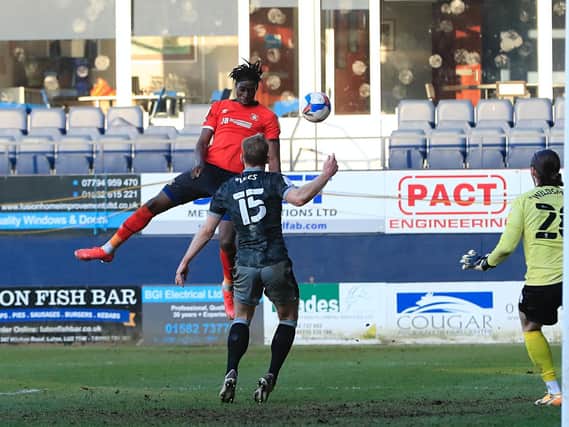 Elijah Adebayo rises highest to head home Town's winner against Sheffield Wednesday this afternoon