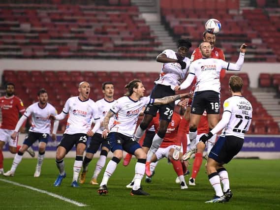 Luton defend a corner at the City Ground this evening
