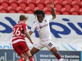Peter Kioso puts in a challenge against Doncaster
