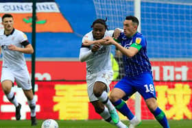 Pelly-Ruddock Mpanzu challenges for possession at Wigan on Saturday