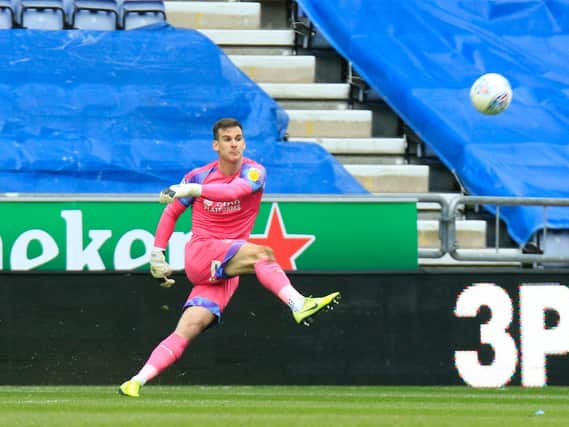 Simon Sluga clears the ball away at Wigan on Saturday