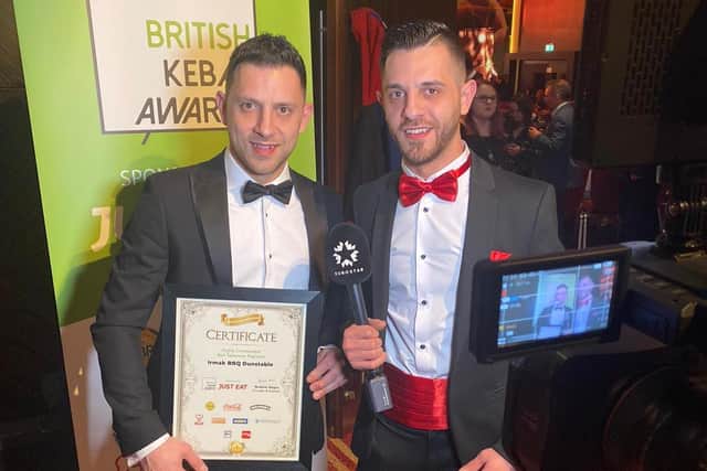 Zak and Orhan with their award