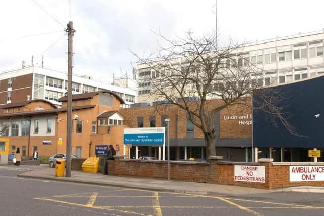 Luton & Dunstable Hospital confirmed two people are self-isolating at home