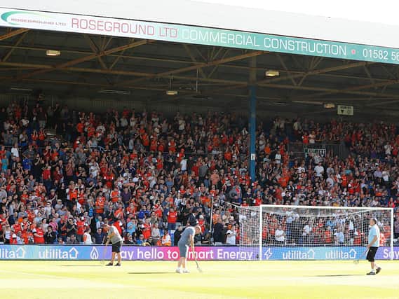 Luton Town's home supporters look on