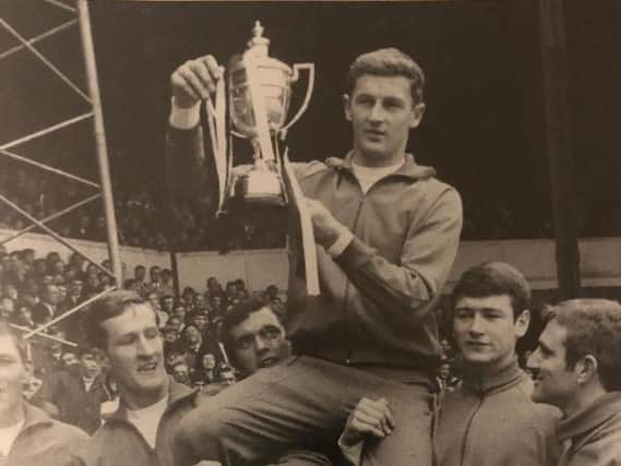 Terry Branston lifts the Division Four title for Luton in 1968