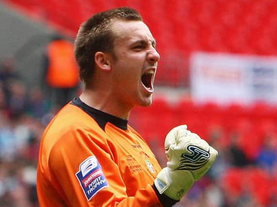 Former Hatter Dean Brill celebrates winning the Johnstone's Paint Trophy with Luton back in 2009