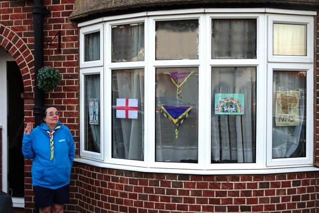 Neckerchiefs hanging in a window