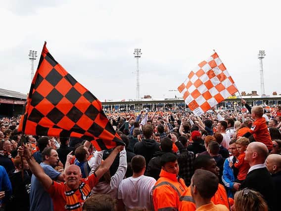 Luton Town fans celebrate promotionb back to the Football League in April 2014