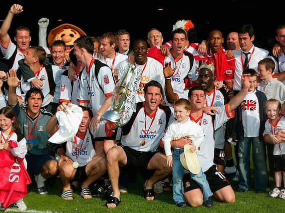 Chris Coyne celebrates winning the League One title back in April 2005
