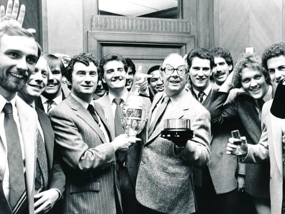 Brian Horton, David Pleat and the Luton squad celebrate their title triumph with Eric Morecambe