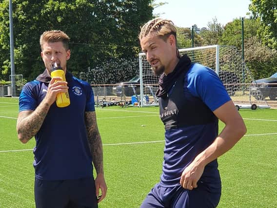 Harry Cornick is back in training with fellow Hatter George Moncur