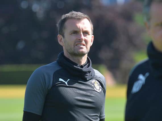 Hatters boss Nathan Jones was back at the Brache today