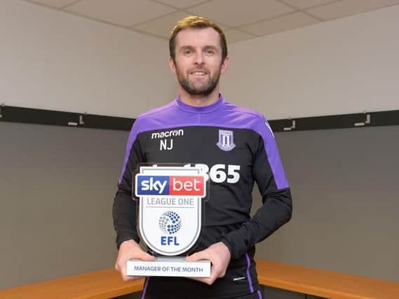 Nathan Jones accepts the manager of the month award for December 2018 won at Luton while wearing his Stoke training gear