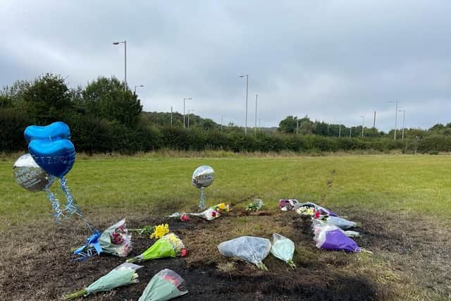 Floral tributes at the scene of the accident