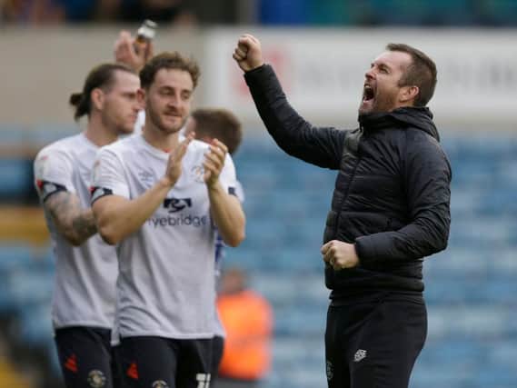 Town boss Nathan Jones celebrates his side's 2-0 win at Millwall on Saturday