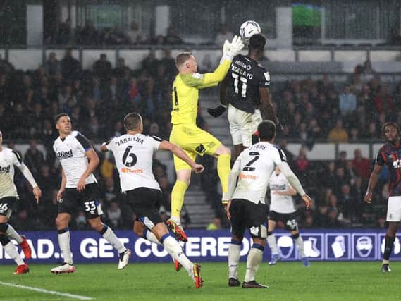 Elijah Adebayo rises highest to head Town level against Derby County
